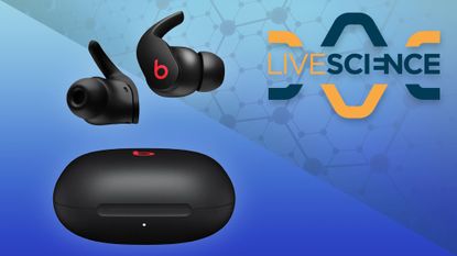 Beats Fit Pro running headphones on blue background with live science logo in top right corner