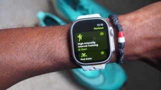 Apple Watch worn on the wrist with workout options