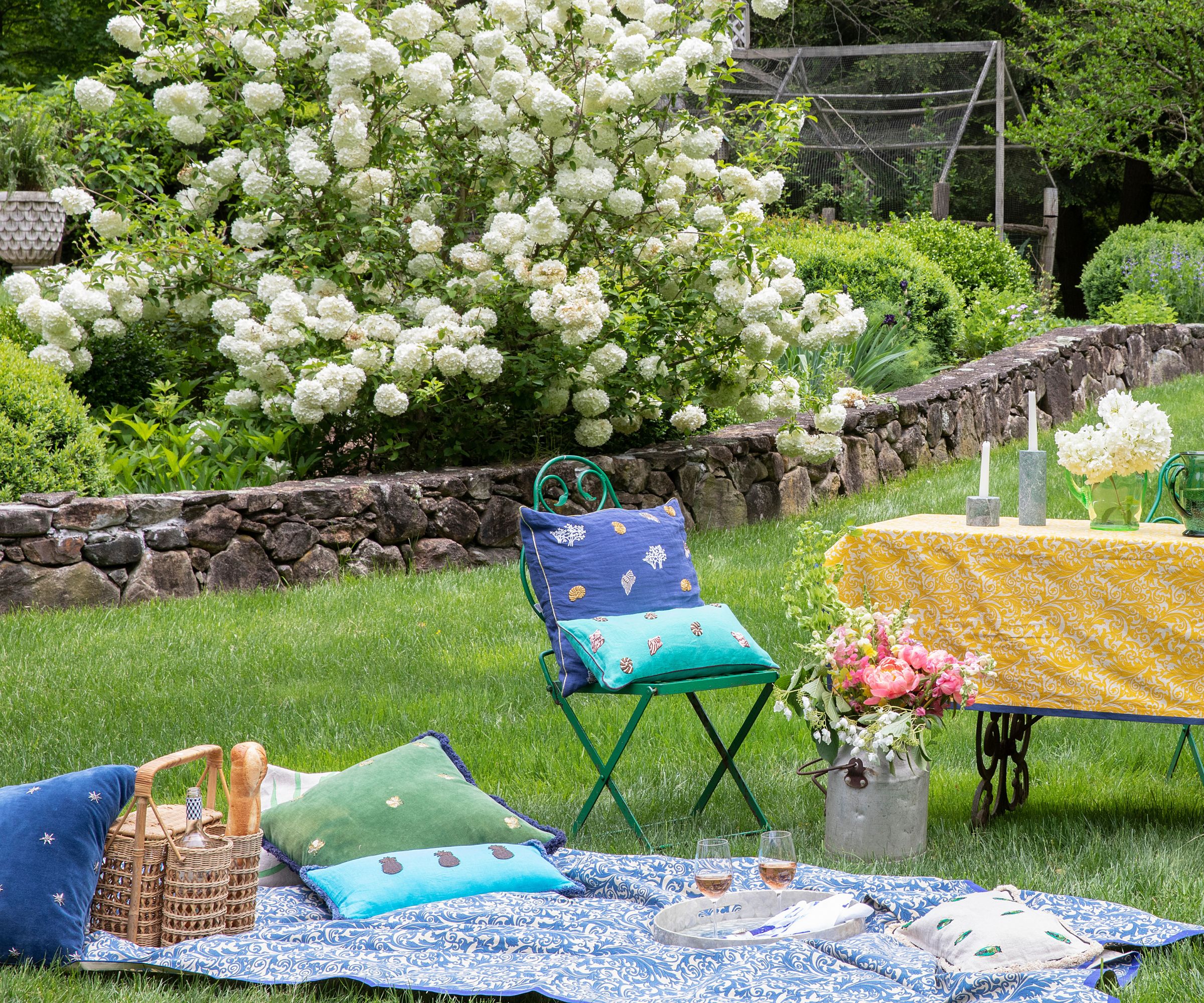 Picnic on a lawn with a bottle carrier and tray