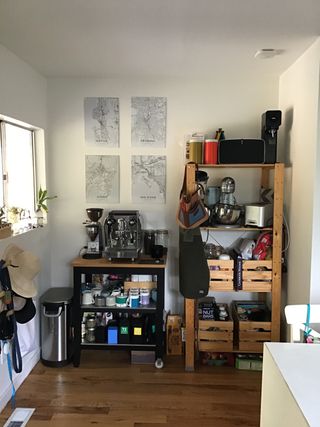 Disorganized kitchen space with cluttered shelves