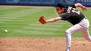 HOLLYWOOD, : Actor Norm MacDonald ("The Norm Show", "Saturday Night Live") tries to stop a third base-line hit 31 July, 1999, during a charity baseball game at Dodgers Stadium in Los Angeles. MacDonald and other Hollywood stars, including David Arquette and Stevin Baldwin, played against one another prior to the scheduled Dodgers-Diamondbacks game. AFP PHOTO / Scott NELSON (Photo credit should read Scott Nelson/AFP via Getty Images)