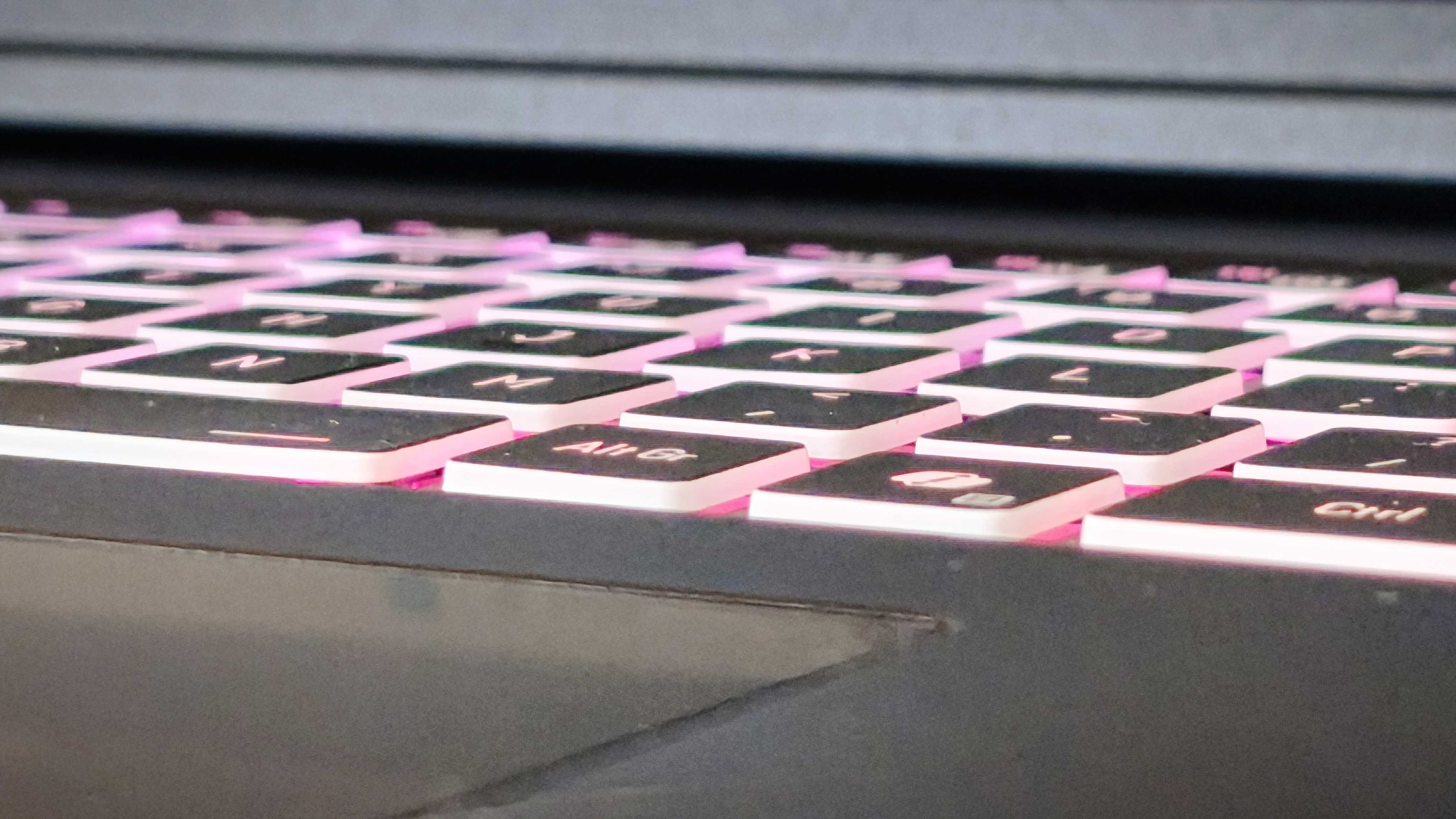 A black Overclockers Pinnacle laptop on a wooden desk
