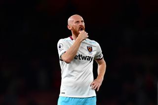 James Collins of West Ham United looks dejected during the Premier League match between Arsenal and West Ham United at the Emirates Stadium on April 5, 2017 in London, England.