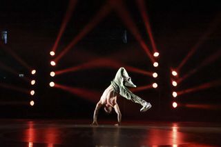 Breakdancer under stage lights, shot with the Canon EOS R1