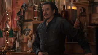 Tommy (Gabriel Luna) standing at the bar in The Last Of Us episode 6