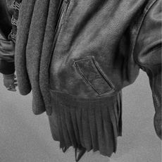 @daniellejinadu wears a grey wool skirt 