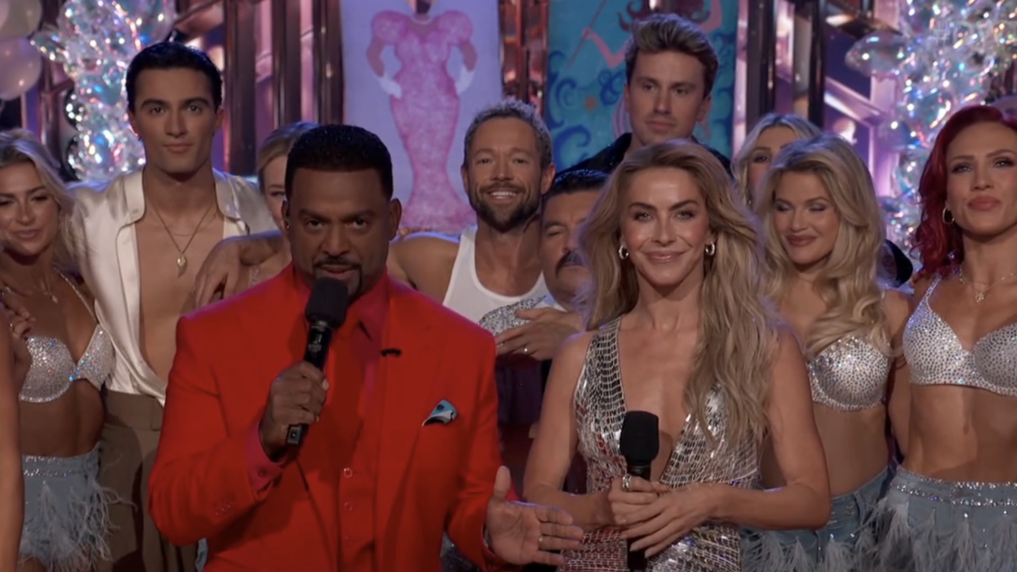 Alfonso in red and Julianne in a silver dress surrounding by the dancers in DWTS Mariah night.