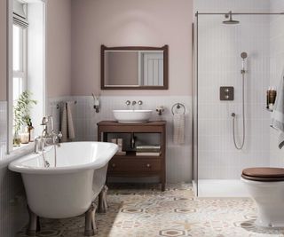 pale pink bathroom with freestanding rolltop bath and separate shower enclosure