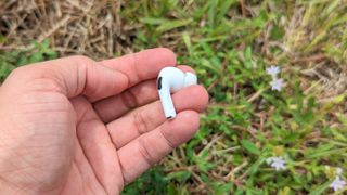 AirPods Pro 2 earbuds in reviewer's hand