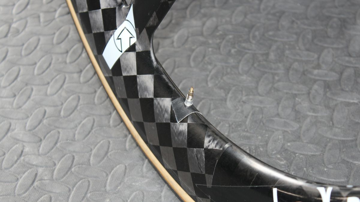 Sometimes the simple solutions are the best; electrical tape keeps the valve stem from rattling in the wheel.