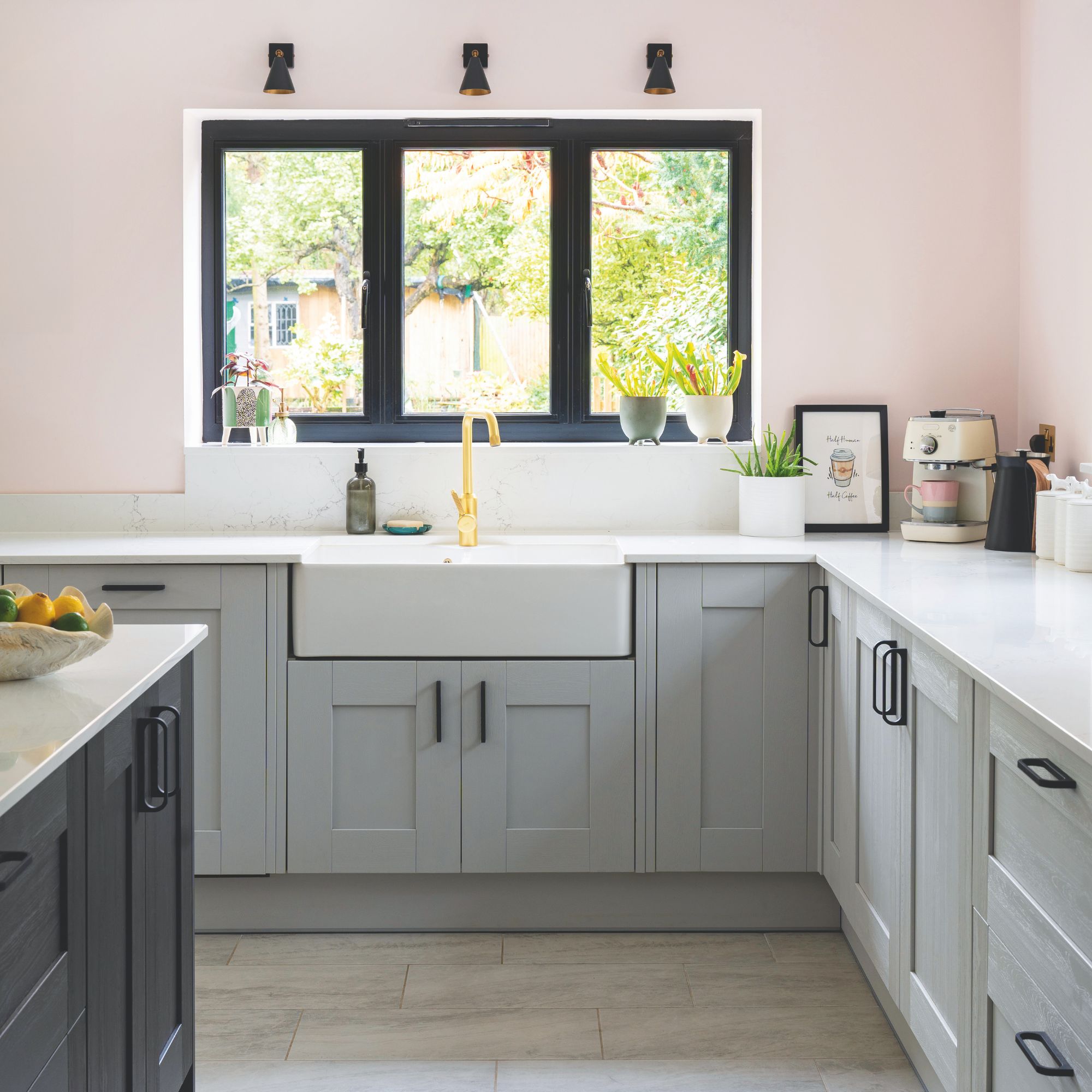 Pink painted kitchen with grey cabinets