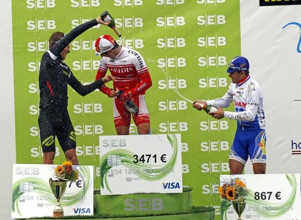 Winner Jean-Eudes Demaret (Cofidis) gets doused with champagne on the podium.