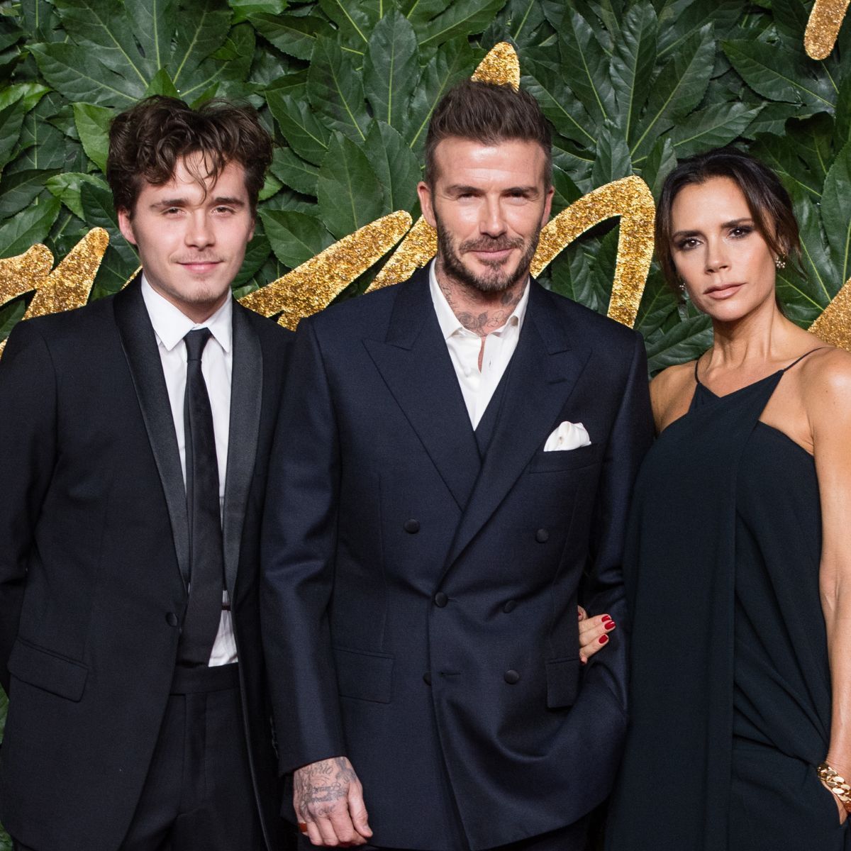 Brooklyn, Victoria and David Beckham attend the 2018 Fashion Awards