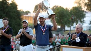 Dustin Johnson with the trophy after winning the US Open
