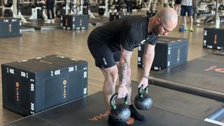 Personal trainer Miller Latvala demonstrates a Romanian Deadlift with two kettlebells