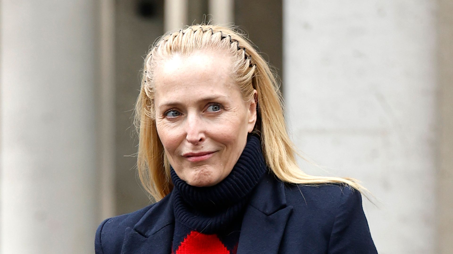 Gillian Anderson leaving Miu Miu's Fall 2026 show at Paris Fashion week on March 10, 2026 in Paris, France