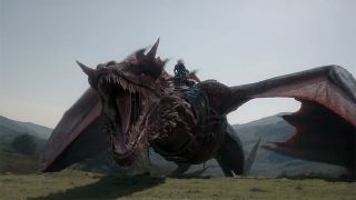 A red dragon roaring on a hill in House of the Dragon season 3