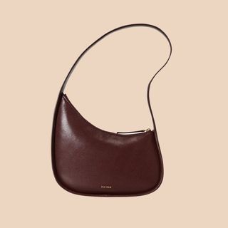 flat lay image of brown handbag