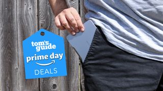 The Khadas Mind mini PC being slipped into a pocket with a Tom's Guide Prime Day deals badge