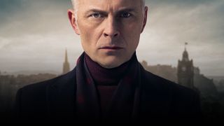 Guilt season 2: Mark Bonnar as Max McCall wearing a turtleneck top and a dark jacket, with the Edinburgh skyline behind him