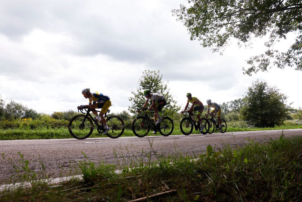 PEER BELGIUM AUGUST 26 LR Kamiel Bonneu of Belgium and Team FlandersBaloise Ludovic Robeet of Belgium and Team Bingoal WB White Combativity Jersey Aaron Van Poucke of Belgium and Team FlandersBaloise and Criel Desal of Belgium and Team Bingoal WB compete in the breakaway during the 19th Renewi Tour 2023 Stage 4 a 1794km stage from Beringen to Peer UCIWT on August 26 2023 in Peer Belgium Photo by Bas CzerwinskiGetty Images