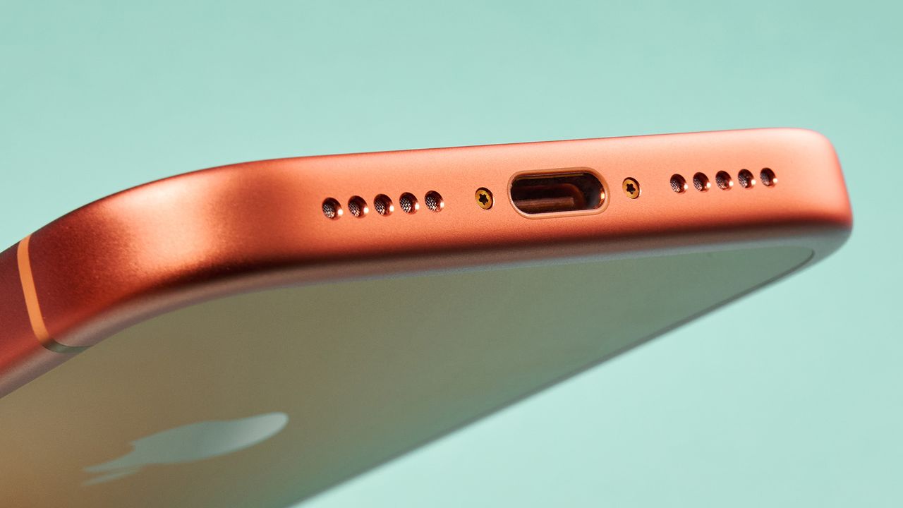 Apple iPhone 17 Pro in cosmic orange on green background