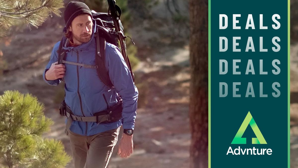 Man hiking in forest wearing Garmin Epix watch