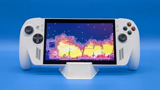 The Xbox Ally held up in its stand and playing Celeste.