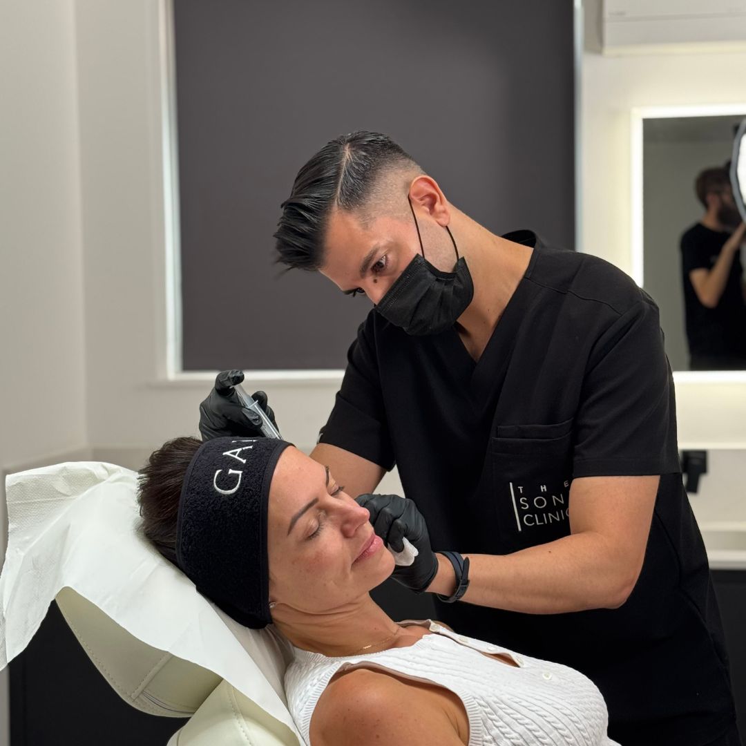 A person receiving a Sculptra treatment