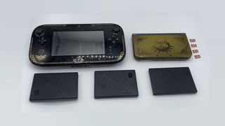A Wii U gamepad, a 3DS, four SD cards, and three external hard drives