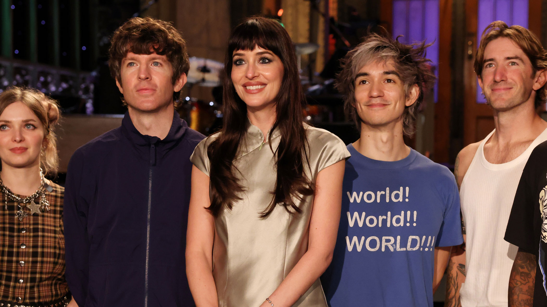 Dakota Johnson hosts SNL wearing a satin miniskirt