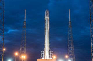 A SpaceX Falcon 9 rocket stands ready to launch a series of Orbcomm commercial satellites into orbit from Cape Canaveral Air Force Station in Florida on Dec. 21, 2015.