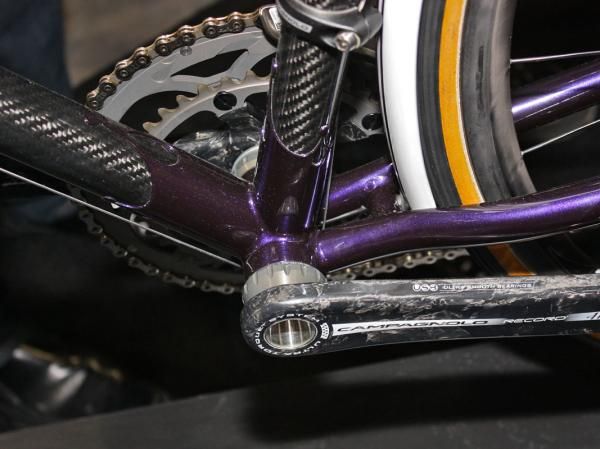The carbon tubes are neatly plugged into the custom welded lugs.