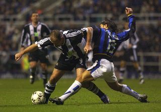Alan Shearer of Newcastle holds off Fabio Cannavaro of Inter during the Champions League, second phase group A, match between Newcastle United and Internazionale Milan at St James' Park on November 27, 2002 in Newcastle, England.