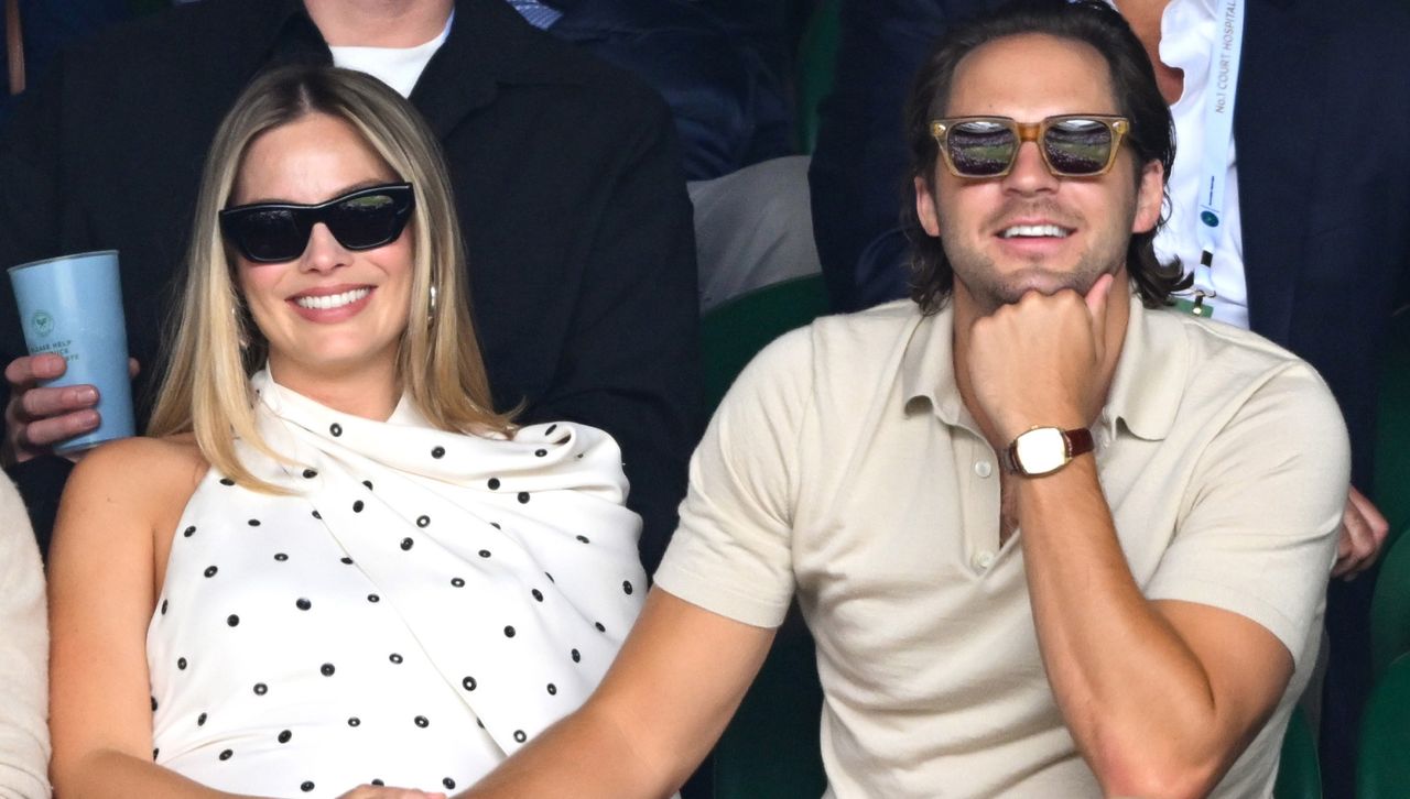 Margot Robbie attends Wimbledon with her husband while wearing a white polka dot dress by Alaïa