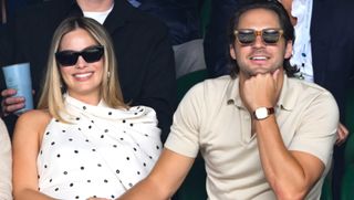 Margot Robbie attends Wimbledon with her husband while wearing a white polka dot dress by Alaïa