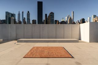 brick on floor, new york skyline in background