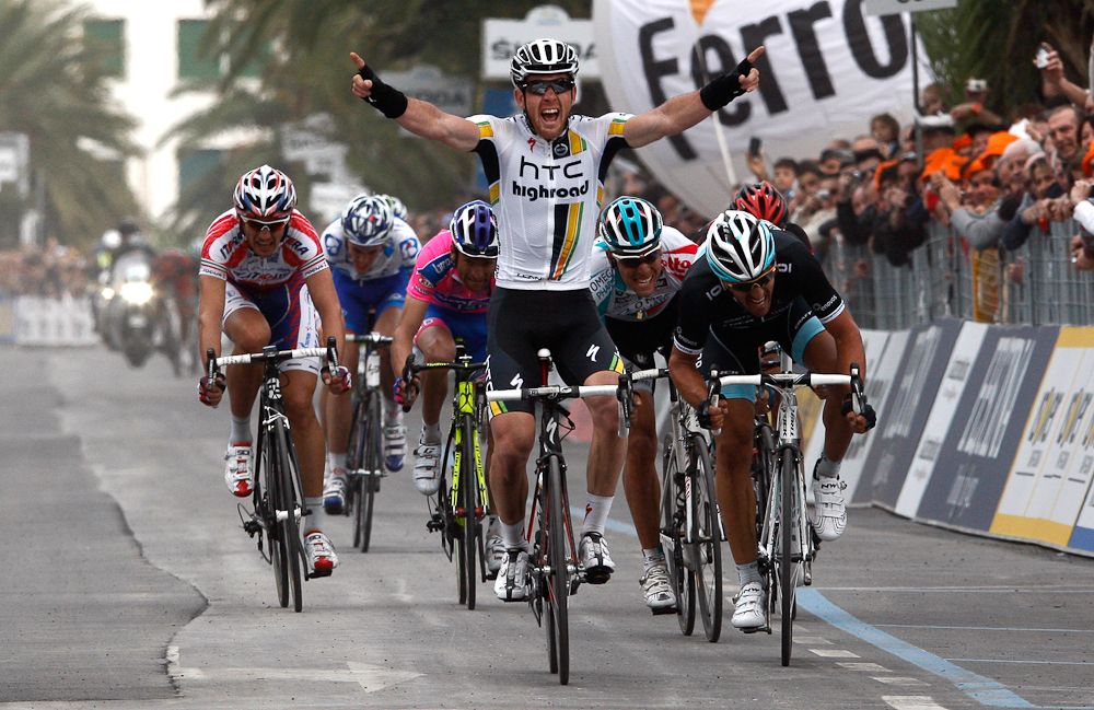 Matthew Goss of the HTC-Highroad team crosses the finish line and wins the the 102th edition of the Milan-San Remo race on March 19, 2011