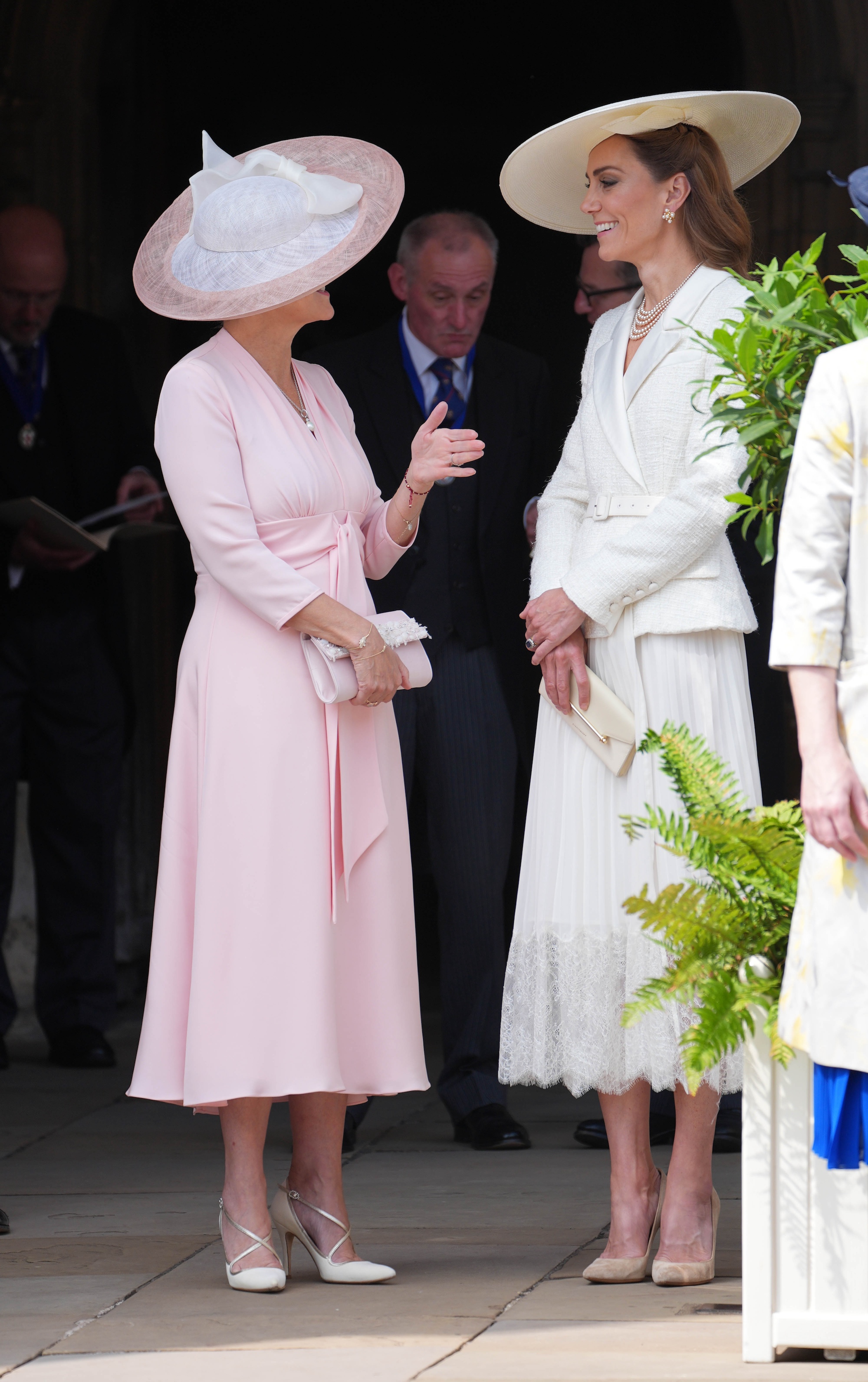 Sophie, Duchess of Edinburgh in a pink dress and pink and white hat and Catherine, Princess of Wales in a white dress and white hat attend the Order of the Garter service at St George's Chapel, Windsor Castle on June 16, 2025