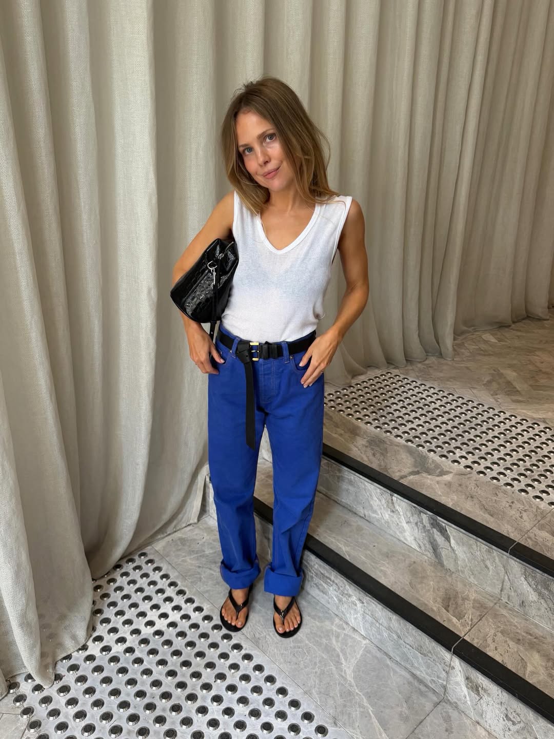 Influencer Rachelle Rowlings wearing cobalt blue trousers.