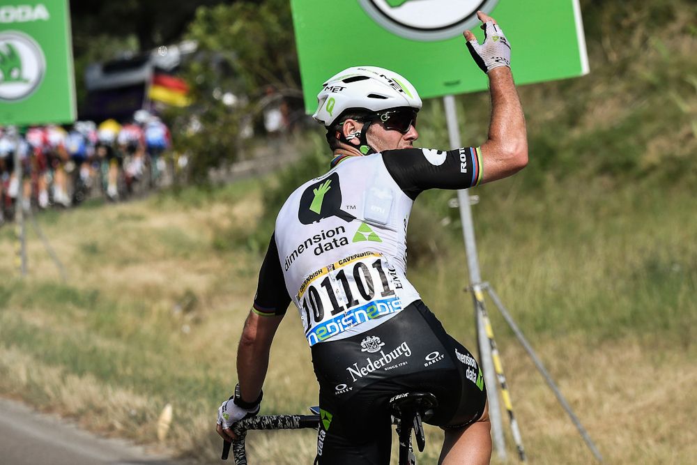 Mark Cavendish signals for support near the end of stage 11 at the Tour de France