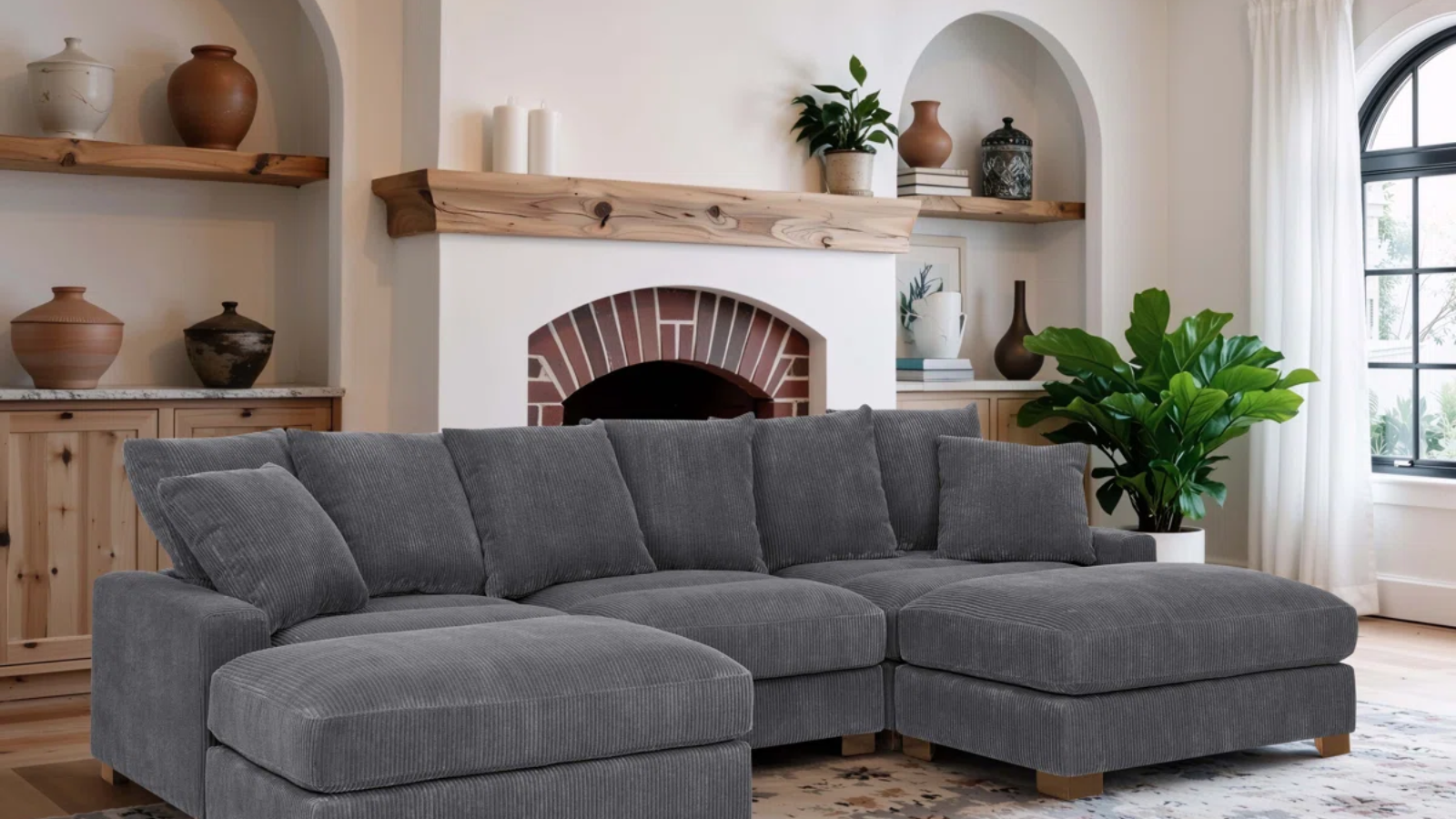a living room with a large gray sectional