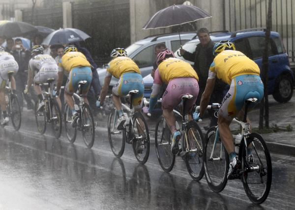 Race leader Alexandre Vinokourov and his Astana teammates amidst miserable weather in stage nine.