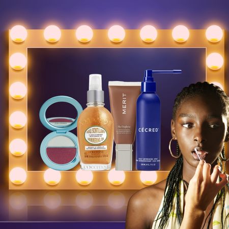 four beauty products surrounded by a lit up makeup mirror and a model getting lipstick applied