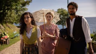 From left to right: newcomer Grace Ambrose stars as Paloma, besides Imogen Waterhouse as Jinny and Matthew Broome as nan's beloved Guy, in a still for The Buccaneers Season 2.