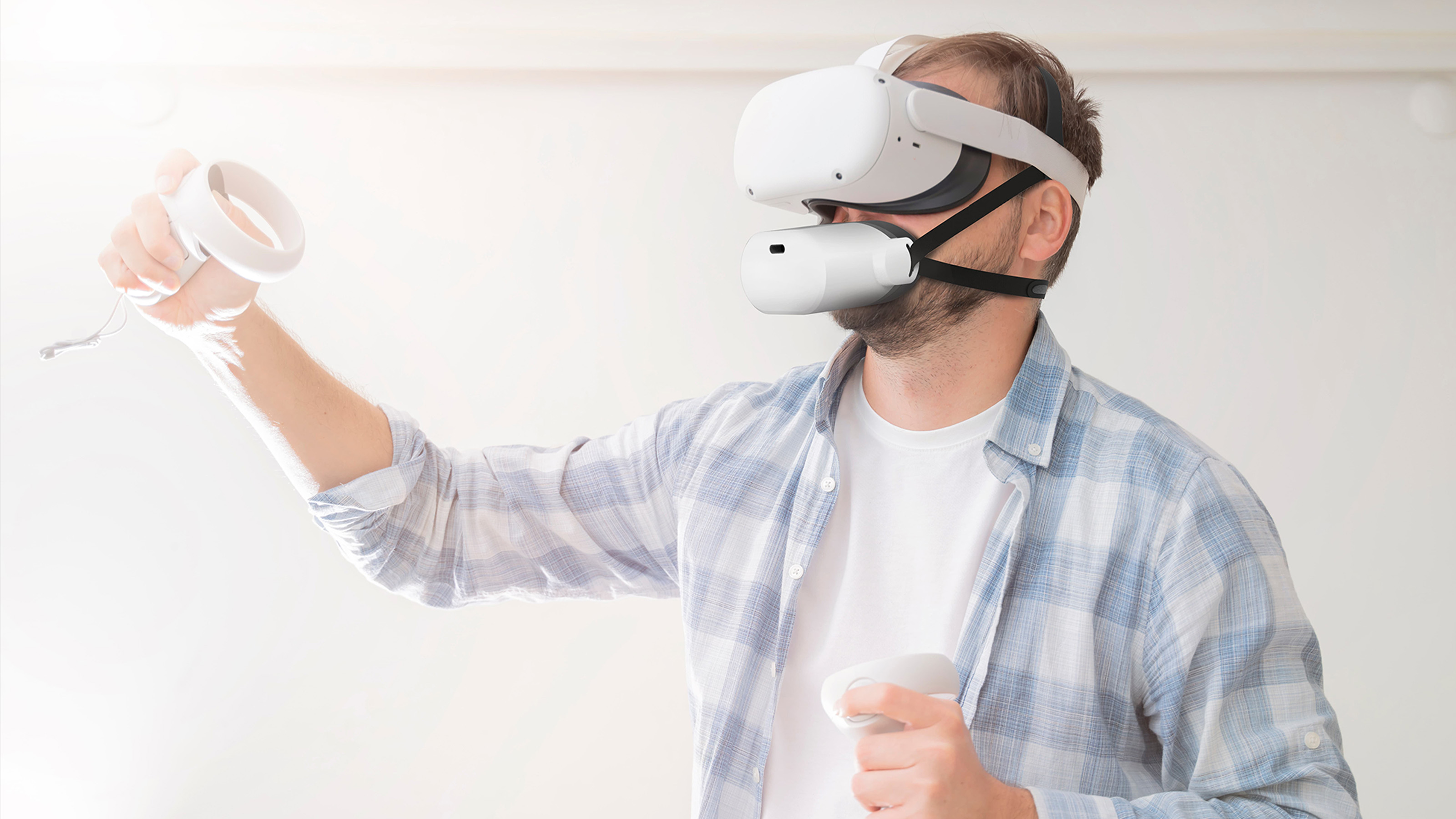 An image of a man wearing the Mutalk microphone and a VR headset on a white background