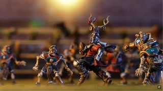 A knight with antlers on his helmet carries a ball while running as skeleton players look on