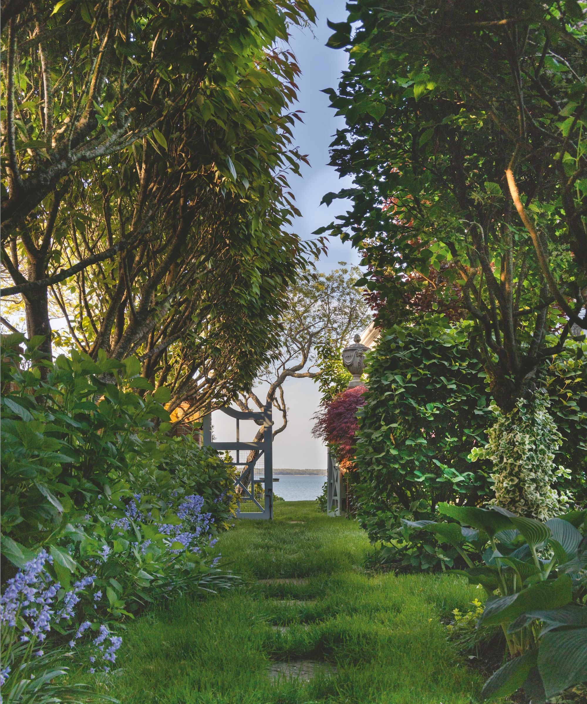 View beyond a garden to the ocean