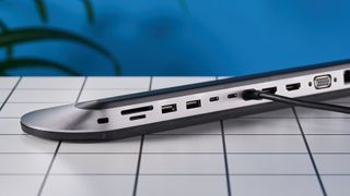 Belkin Connect 11-in-1 USB-C Pro Docking station on a white tabletop with a blue background