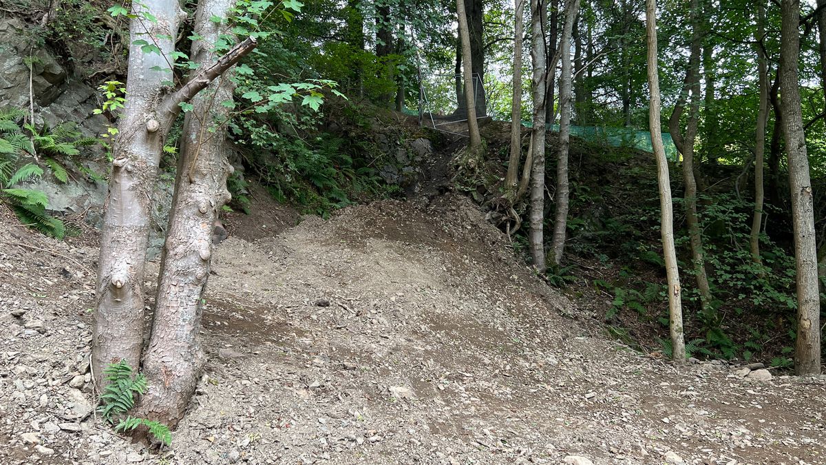 Tom Pidcock on one of the feature jumps at Glentress, Scotland